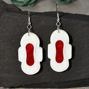 Boucles d'oreilles serviettes hygiéniques