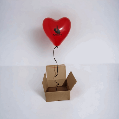 Box surprise ballon en forme de cœur rouge doigt d'honneur