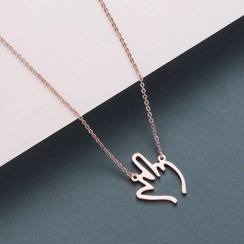 Collier Pendentif Doigt d'honneur couleur or rose